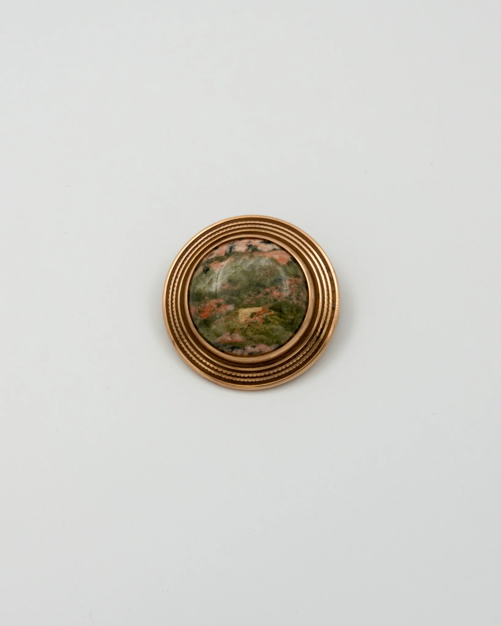 Held stone buckle bronze unakite
